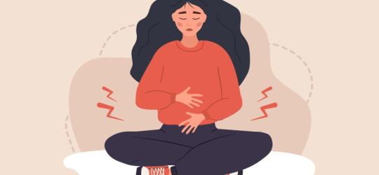 Grafika 2D zmartwionej kobiety, cierpiącej na dolegliwości ze strony układu rozrodczego.