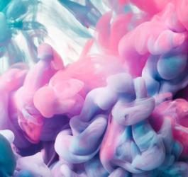 Kolorowe krople atramentu w wodzie.