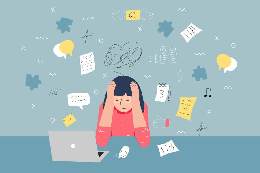 Rysunkowa kobieta siedzi zrezygnowana przy komputerze, cierpi na wypalenie zawodowe.